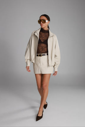 חצאית מיני ג'וליה דמוי עור שמנת