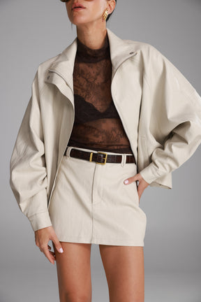 חצאית מיני ג'וליה דמוי עור שמנת